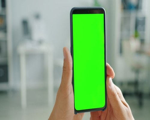 Smartphone displaying a fictional mobile game interface during a tech demo